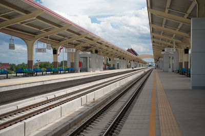 Railroad station platform against sky