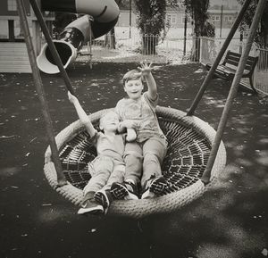 Boy on swing in playground