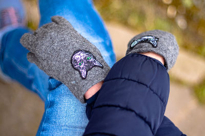 Low section of man wearing shoes