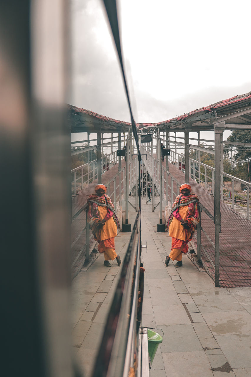 PEOPLE WORKING ON RAILROAD TRACK