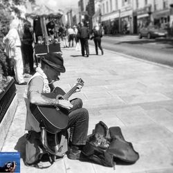 Man looking at city street