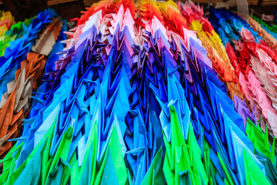 Close-up of multi colored umbrellas hanging on clothesline