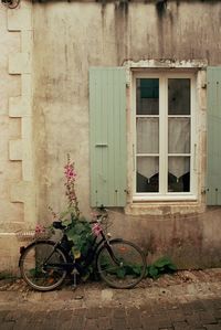 Bicycle against wall of building