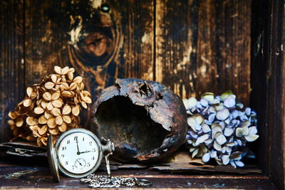 Close-up of various flowers on wooden table