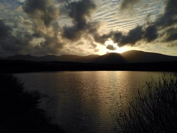 Scenic view of lake at sunset