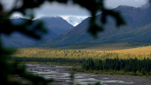 Scenic view of snowcapped mountains against sky