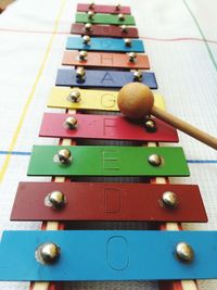 High angle view of letters on colorful glockenspiel