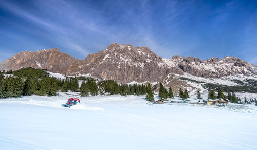 Snowplough in winter landscape