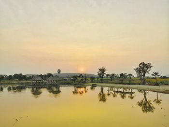 Scenic view of lake against sky during sunset