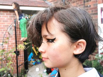 Close-up portrait of a girl looking down