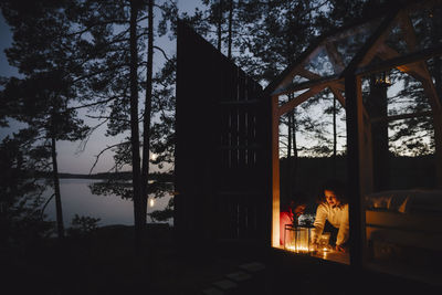 Couple looking at candles in cottage