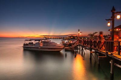 Scenic view of river against sky at night
