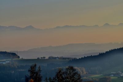 Scenic view of silhouette mountains against sky during sunset