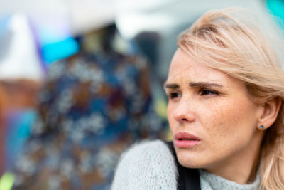 Close-up of thoughtful woman looking away outdoors