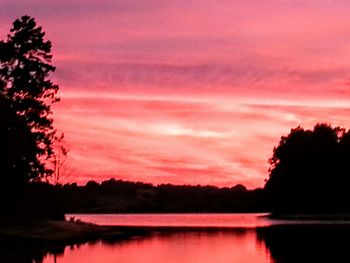 Scenic view of lake at sunset