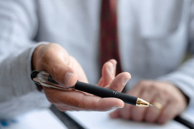 Close-up of man holding hands
