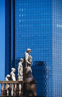 Statue against blue sky
