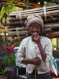 Full length of man holding plant