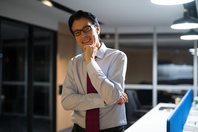 Portrait of smiling businessman at office