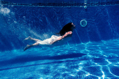 Man swimming in pool