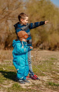 Boy standing on field