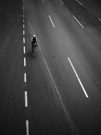 High angle view of person cycling on road