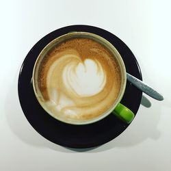 Close-up of cappuccino on table