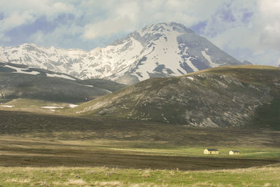 Scenic view of snowcapped mountains against sky