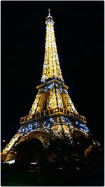 Low angle view of tower at night