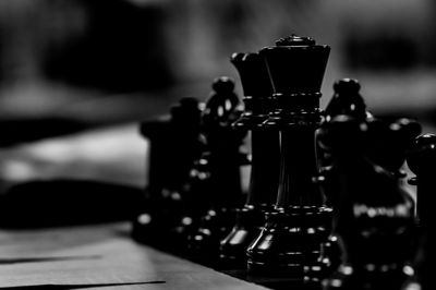 Close-up of chess pieces on table