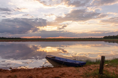 Sunset on the lake. beautiful sunset behind the storm clouds before a thunder storm 