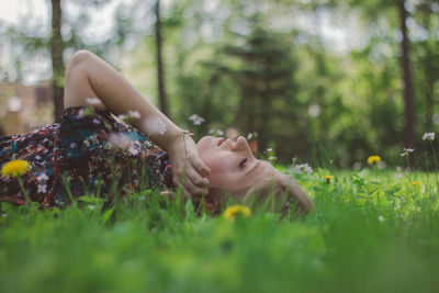 Woman lying on field