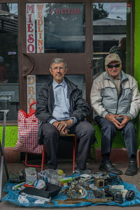 Portrait of a young man sitting on seat