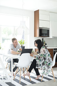 Young couple at dinner table, sweden