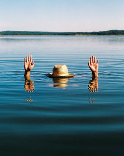 Reflection of hands in water