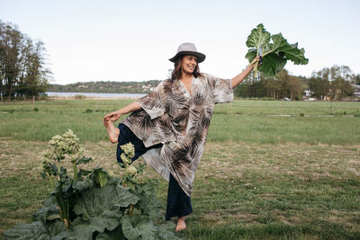 Woman holding leaf