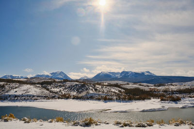 Scenic view of snowcapped mountains against sky