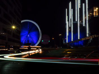 Light trails on city street at night