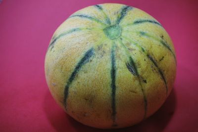 Close-up of pumpkin against red background