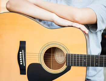 Close-up of hand holding guitar