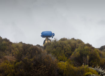 Man on mountain during foggy weather