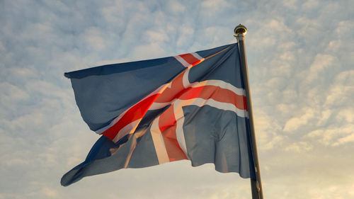 Low angle view of flag against sky