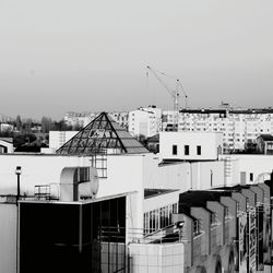 Houses in city against sky