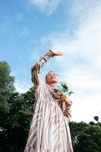 Low angle view of statue against sky