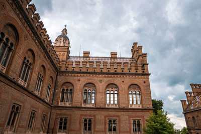 Low angle view of historic building against sky