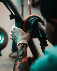 Polishing a cage for a car.