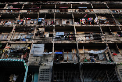 Low angle view of clothes drying on balconies