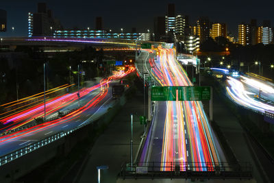 High angle view of light trails on road at night