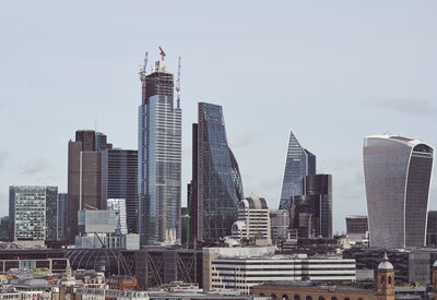 Modern buildings in city against sky