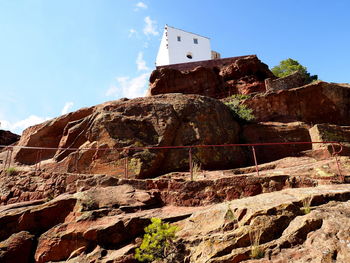 Low angle view of old castle on mountain